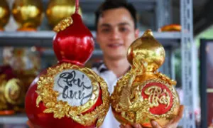Bầu hồ lô dát vàng giá hơn triệu đồng một cặp Bầu hồ lô dát vàng giá hơn triệu đồng một cặp